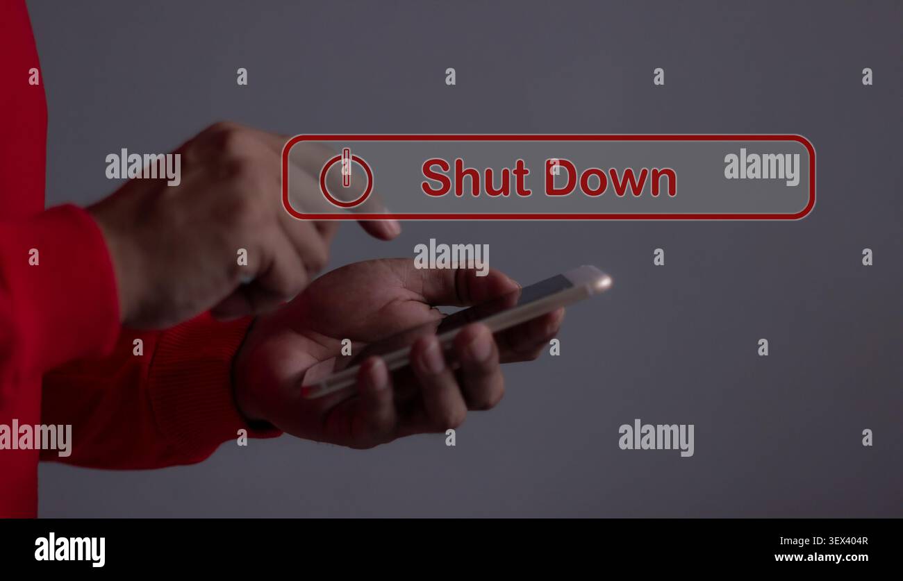 Young man with smartphone hand touching Shut Down button press power OFF Stock Photo