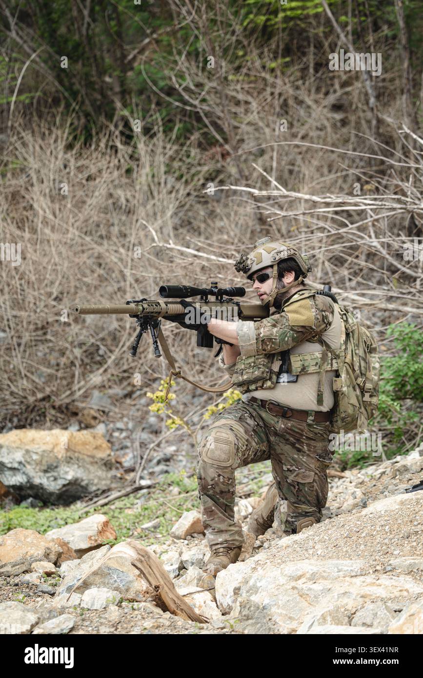 Reconnaissance Operations Army Military sniper aiming precision rifle during tactical reconnaissance ...
