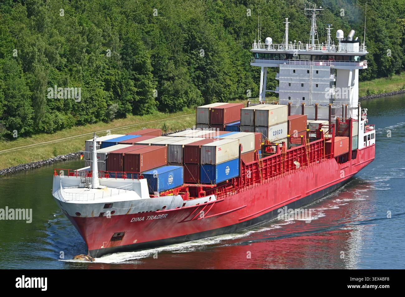 Containership DINA TRADER passing the Kiel canal Stock Photo