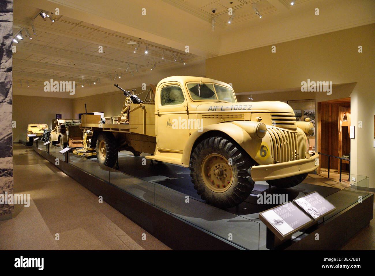 Australia, Australian Capital Territory, Canberra, Australian War Memorial, Second World War gallery, 1941 Chevrolet model 41/E22 military truck of the Australian Imperial Force, fitted with an anti-aircraft gun, displayed with other vehicles used during the Middle East and North African campaigns Stock Photo