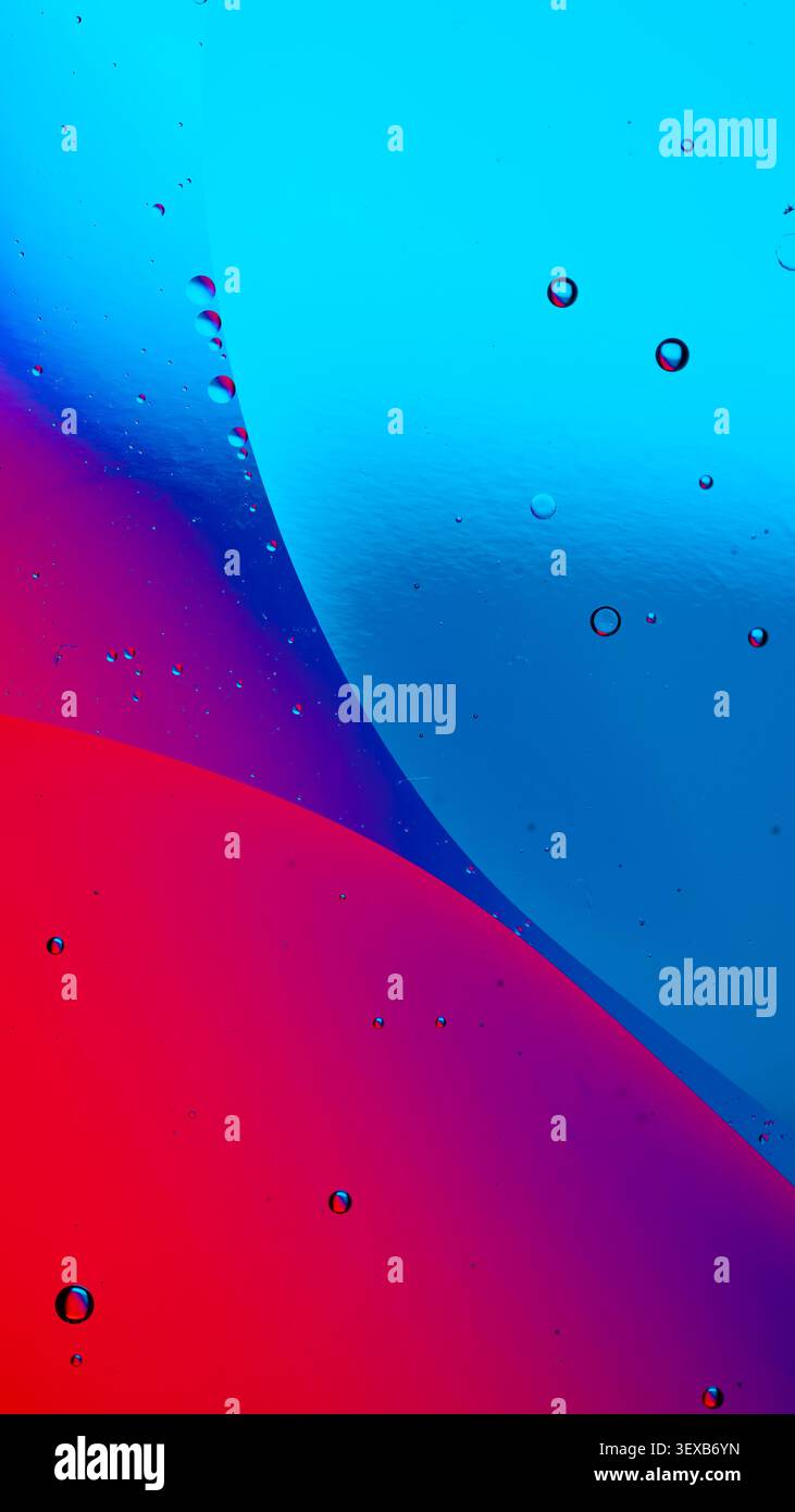 Oil and water creating an abstract background with colorful liquid and bubbles Stock Photo