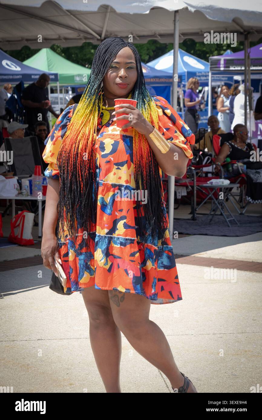 An attractive woman with extra long colorful extensions at the African American Cultural Festival in Kensico Dam Plaza in Valhalla, NY. Stock Photo