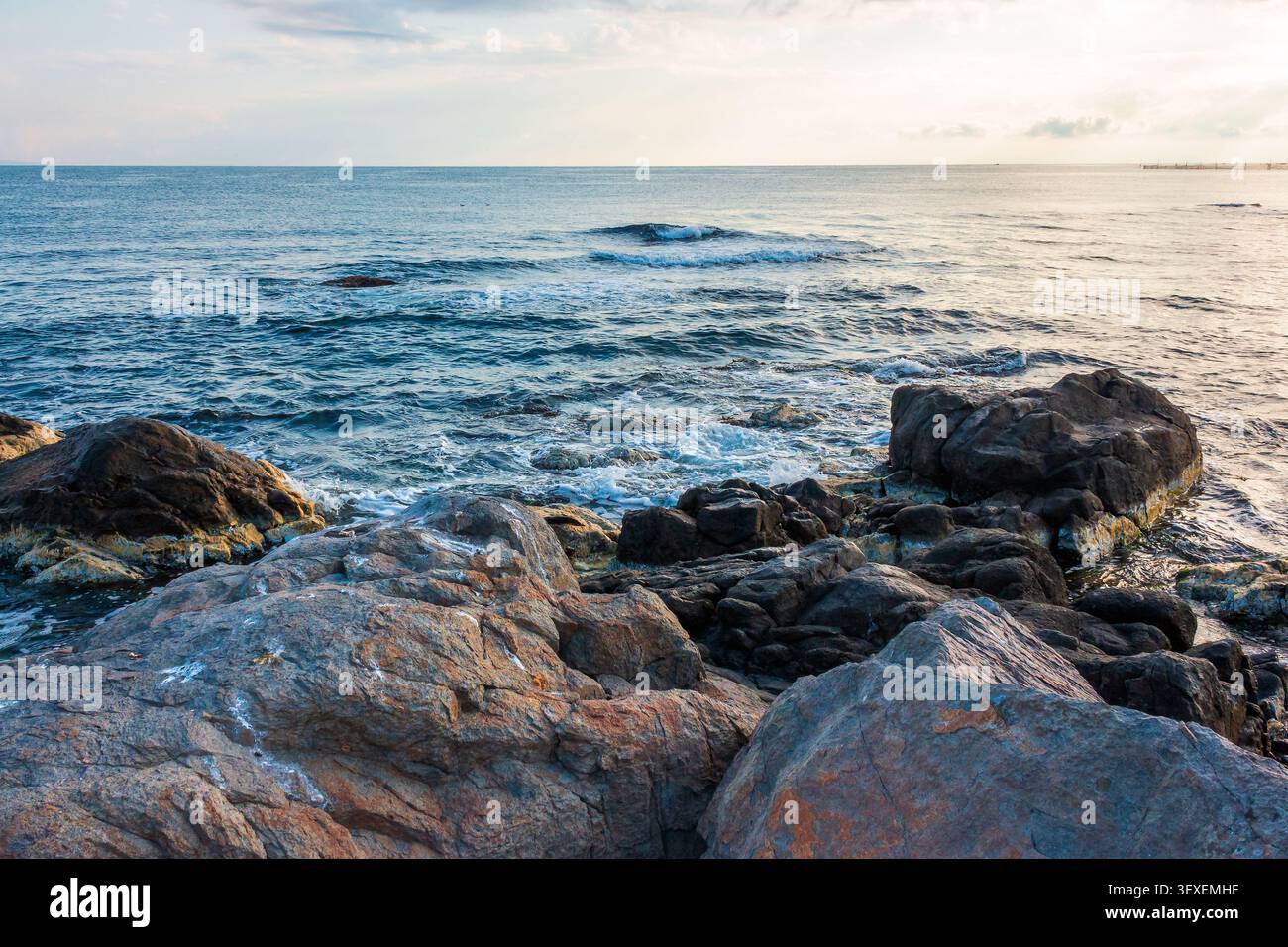 sea coast with stones and rocks. summer vacation background. seascape in the morning light. relaxing at the sea. coast of bulgaria Stock Photo