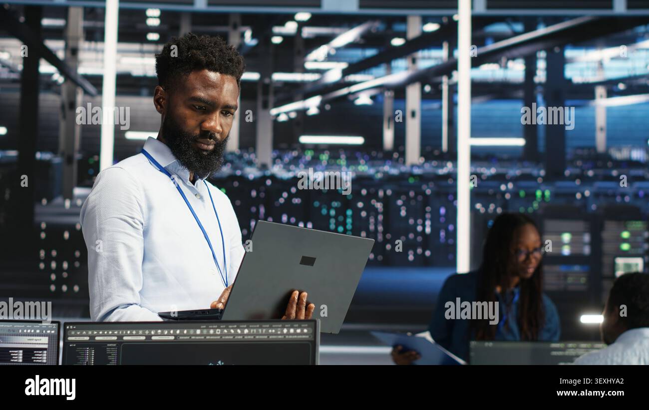 Data center engineer uses node tree software to identify equipment performance issues and data patterns. Stock Photo