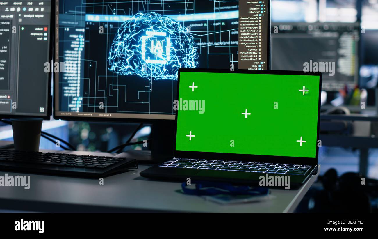 IT specialist reviews neural network visualization on green screen computers in a server room during software debugging work. Stock Photo