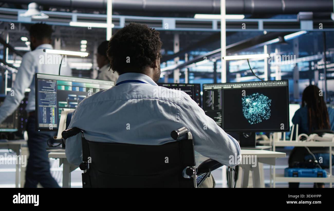 Server room software programmer with paraplegia interprets AI generated data analytics graphs, while man in wheelchair working with AI program showing predictive system metrics in server facility. Stock Photo