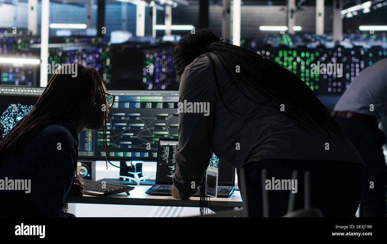 Data center engineering team uses node tree AI software to analyze infrastructure and identify issues in a data center. Stock Photo