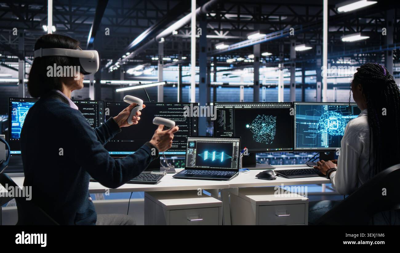 High tech server room technical specialist working with virtual reality. Stock Photo