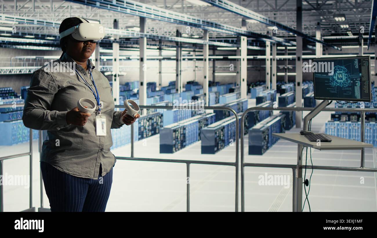 Data center engineer uses a VR headset in a server room to adjust AI systems and improve processing performance. Stock Photo