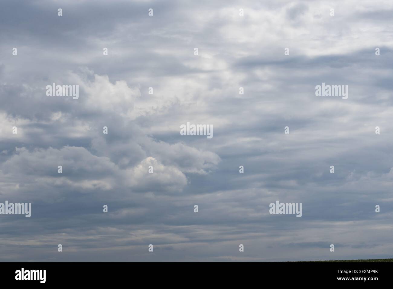 Textured overcast sky with dramatic storm clouds before rainfall creating a natural weather background Stock Photo
