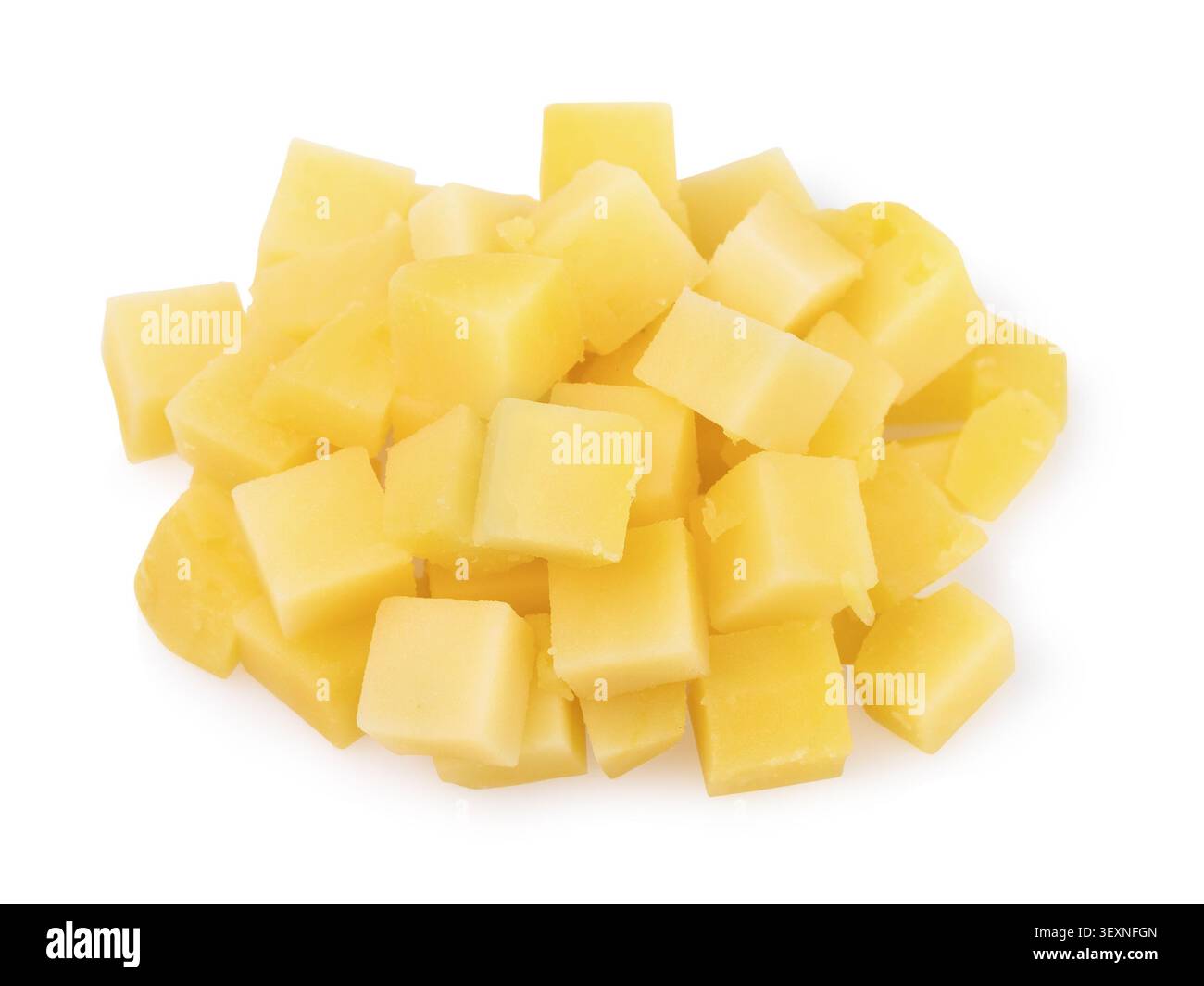 Pile of raw peeled potato cut into cubes, isolated on white background, side view Stock Photo