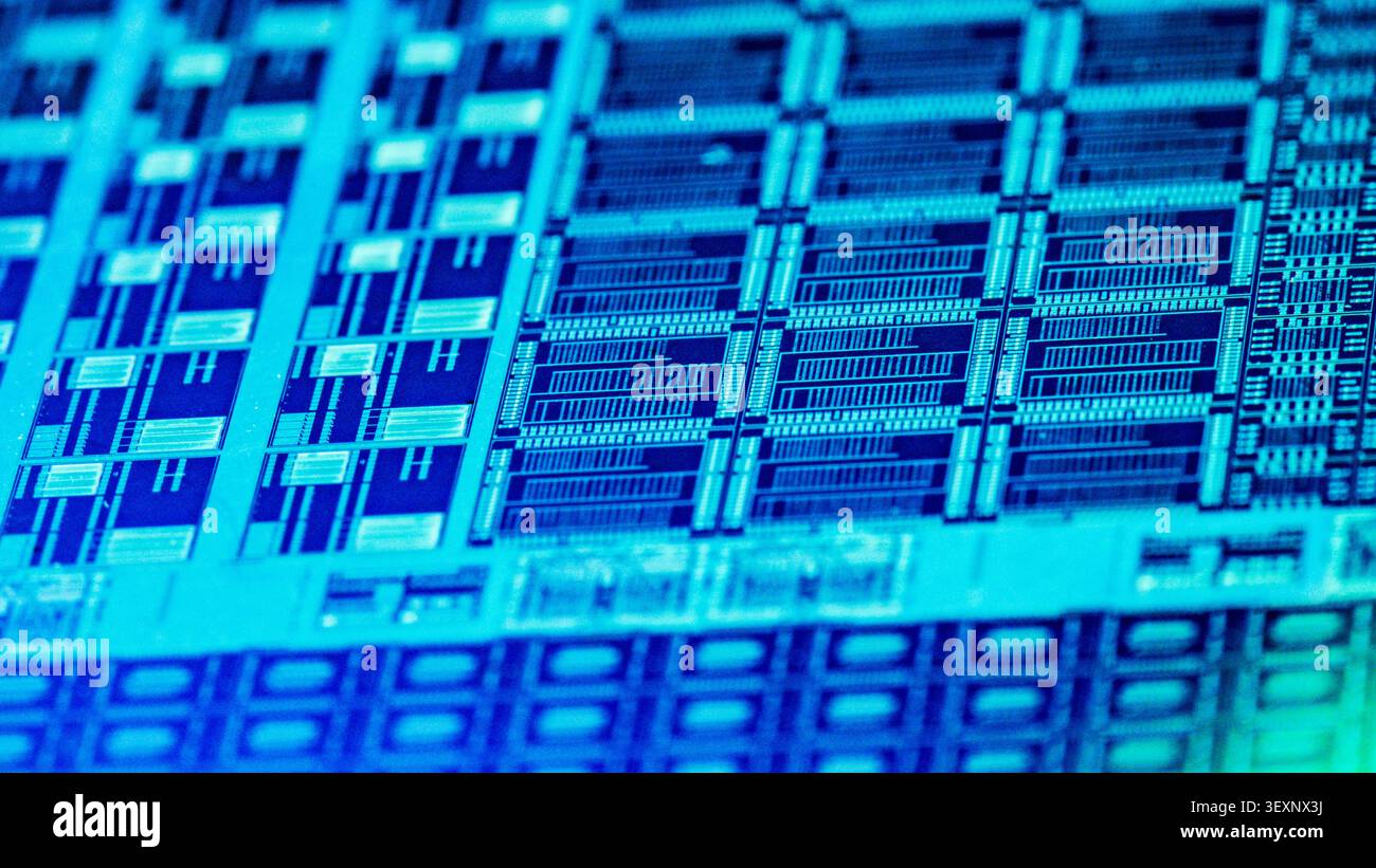 Silicon wafer displaying intricate microchip circuits and advanced technology components Stock Photo