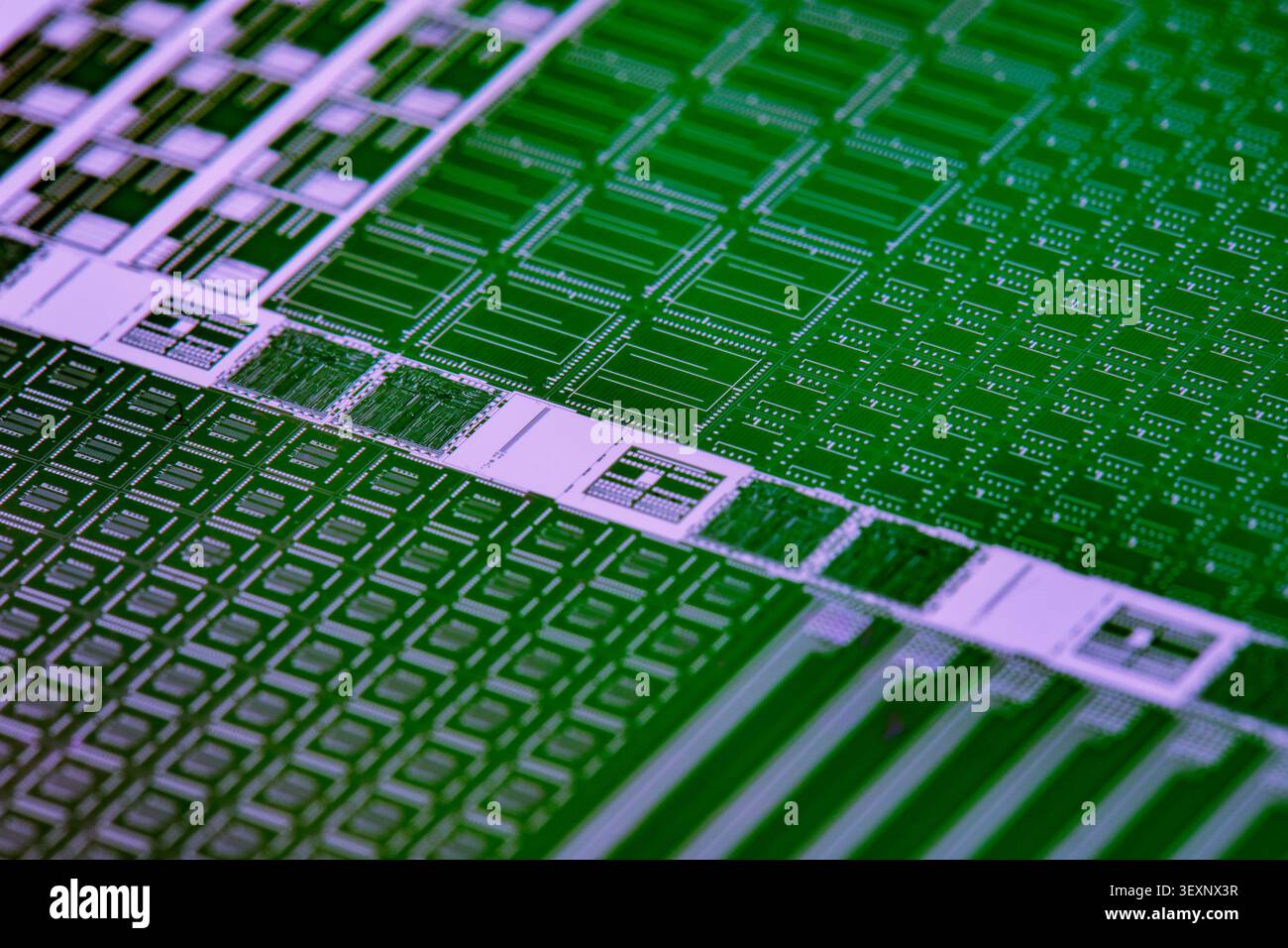 Silicon wafer surface with microchip patterns representing advanced semiconductor technology Stock Photo