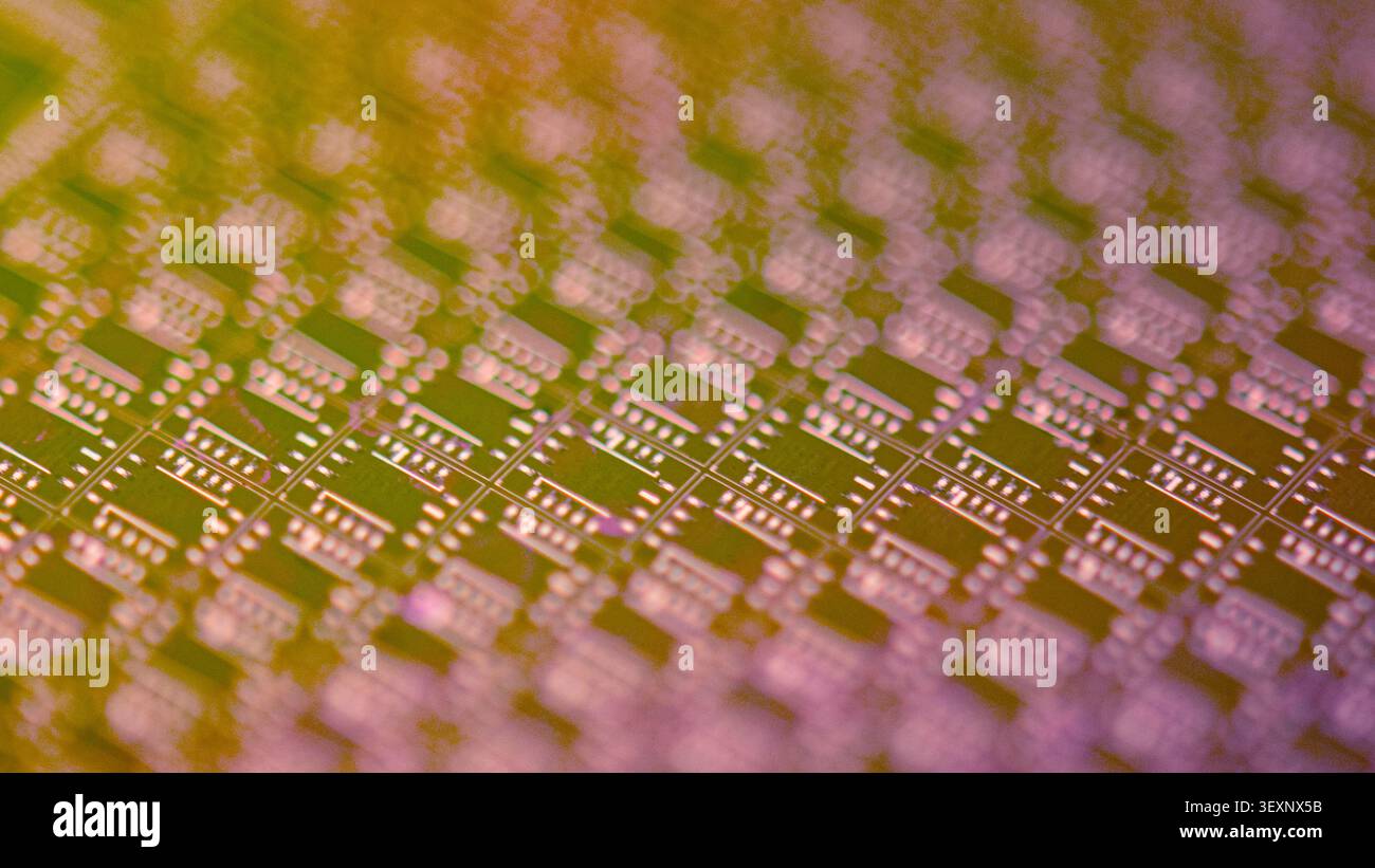Wafer's surface showing circuitry patterns creating electronic chips Stock Photo
