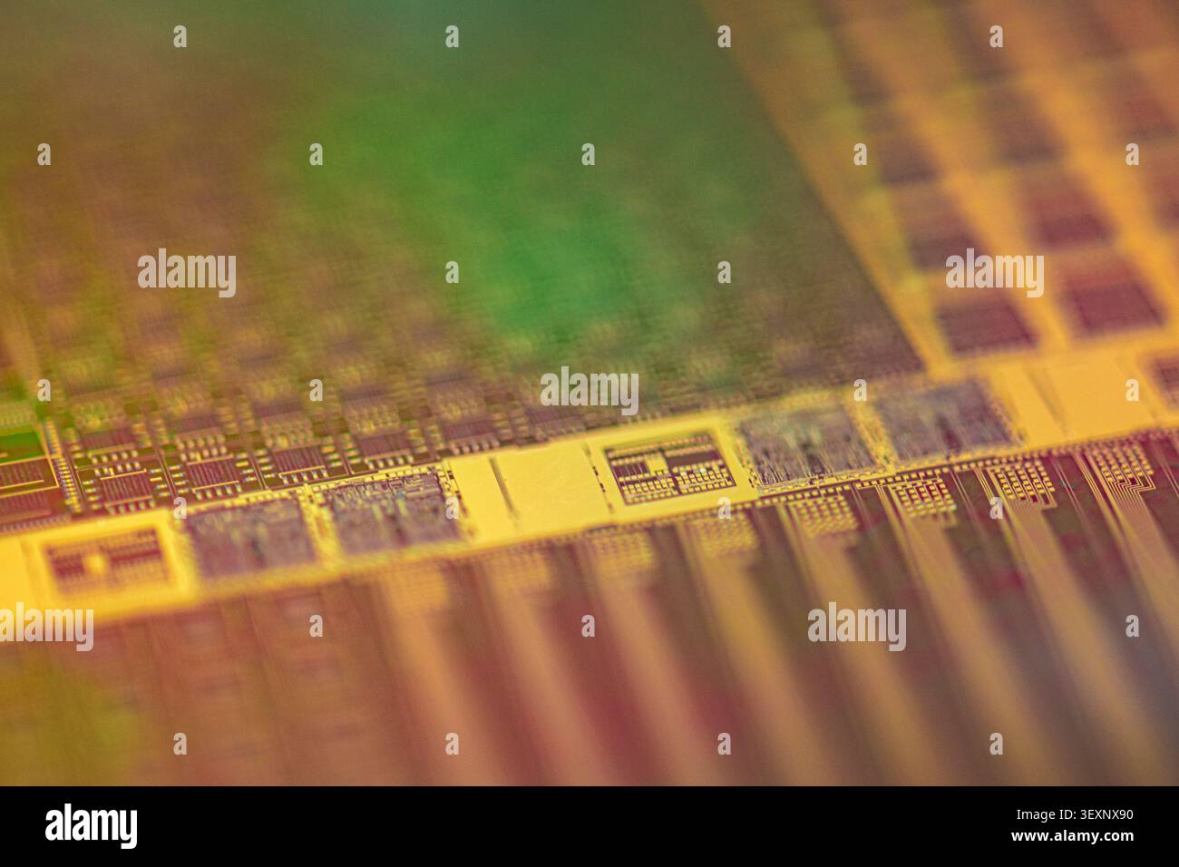 Silicon wafer with intricate microchip patterns representing advanced semiconductor technology Stock Photo