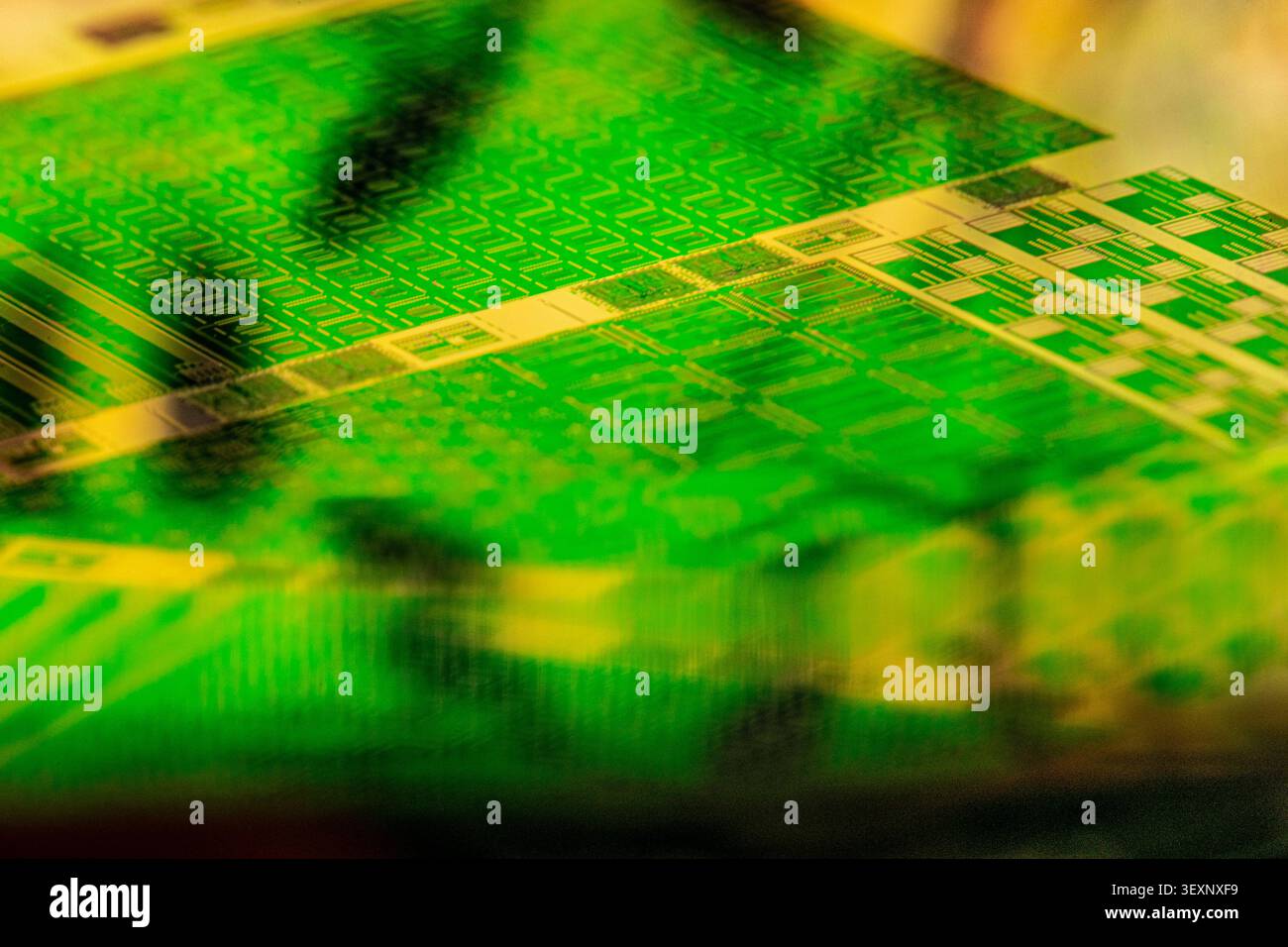 Electronic wafer showcasing abstract patterns and intricate microchip components Stock Photo