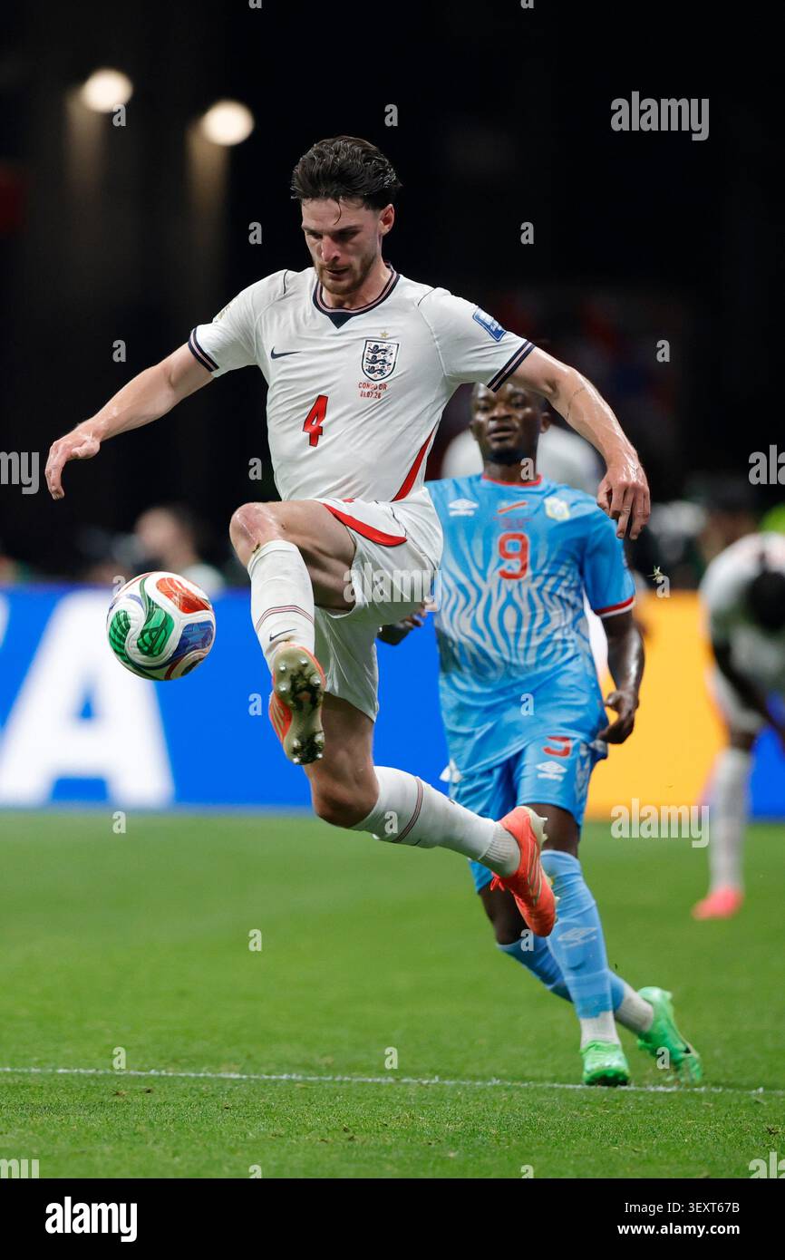 England's Declan Rice (4) jumps for the ball with ahead of Congo's ...