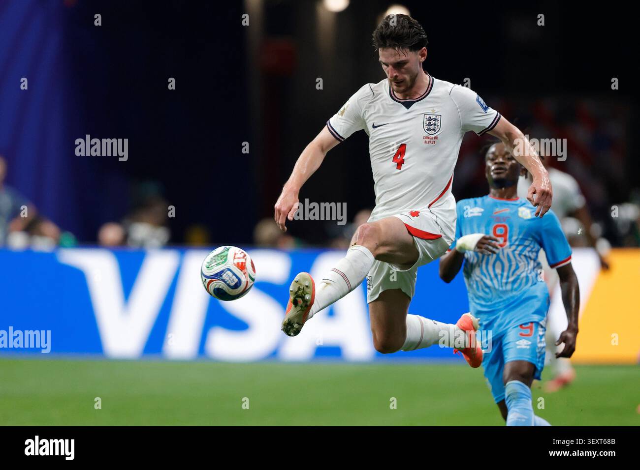 England's Declan Rice (4) jumps for the ball with ahead of Congo's ...