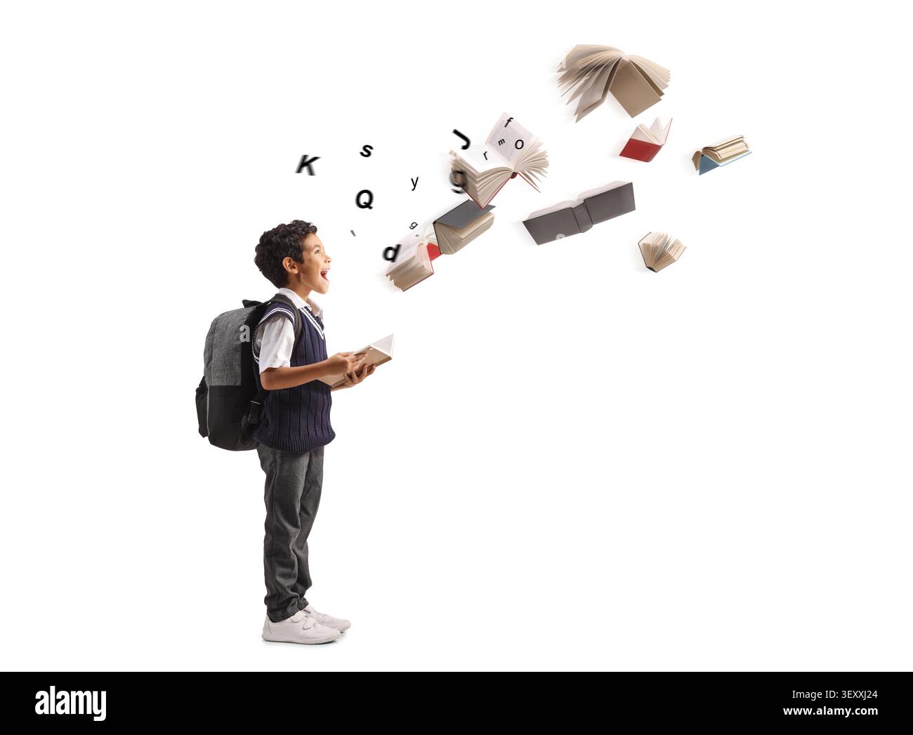 Excited schoolboy with a backpack looking at flying books and letters on a white background Stock Photo