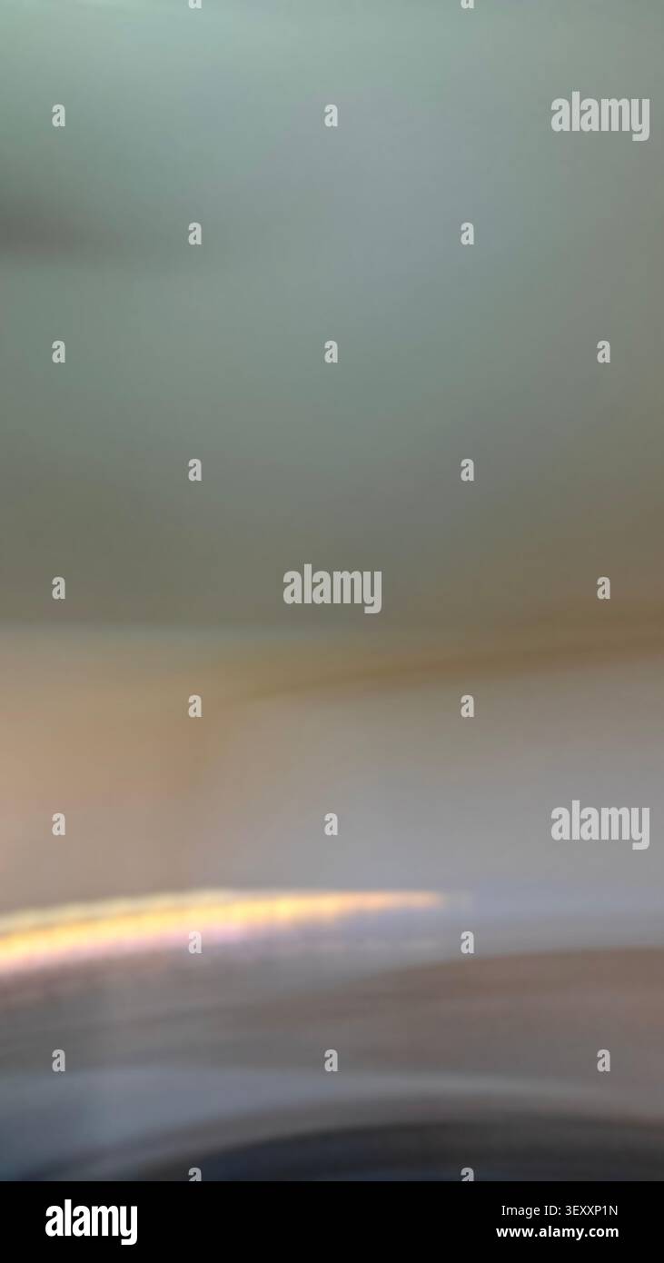 Blurred light streak creating an abstract, minimalist background with a gradient effect Stock Photo