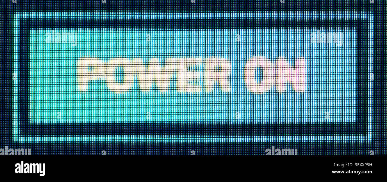 Power on message displaying on a blue glowing old electronic screen Stock Photo