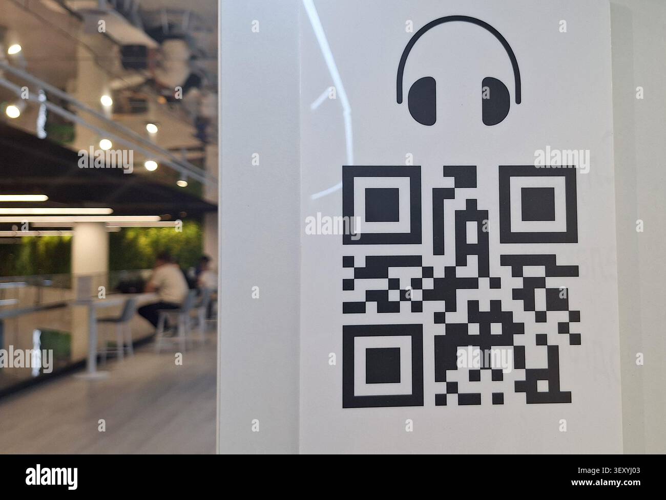 Interactive Digital Experience Featuring QR Code Linked to Music and Audio Content Exploration Stock Photo