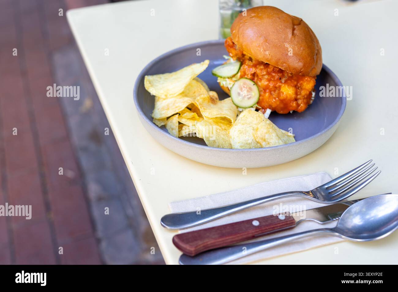 Cheeseburger and Chips Restaurant Presentation Close-Up Stock Photo