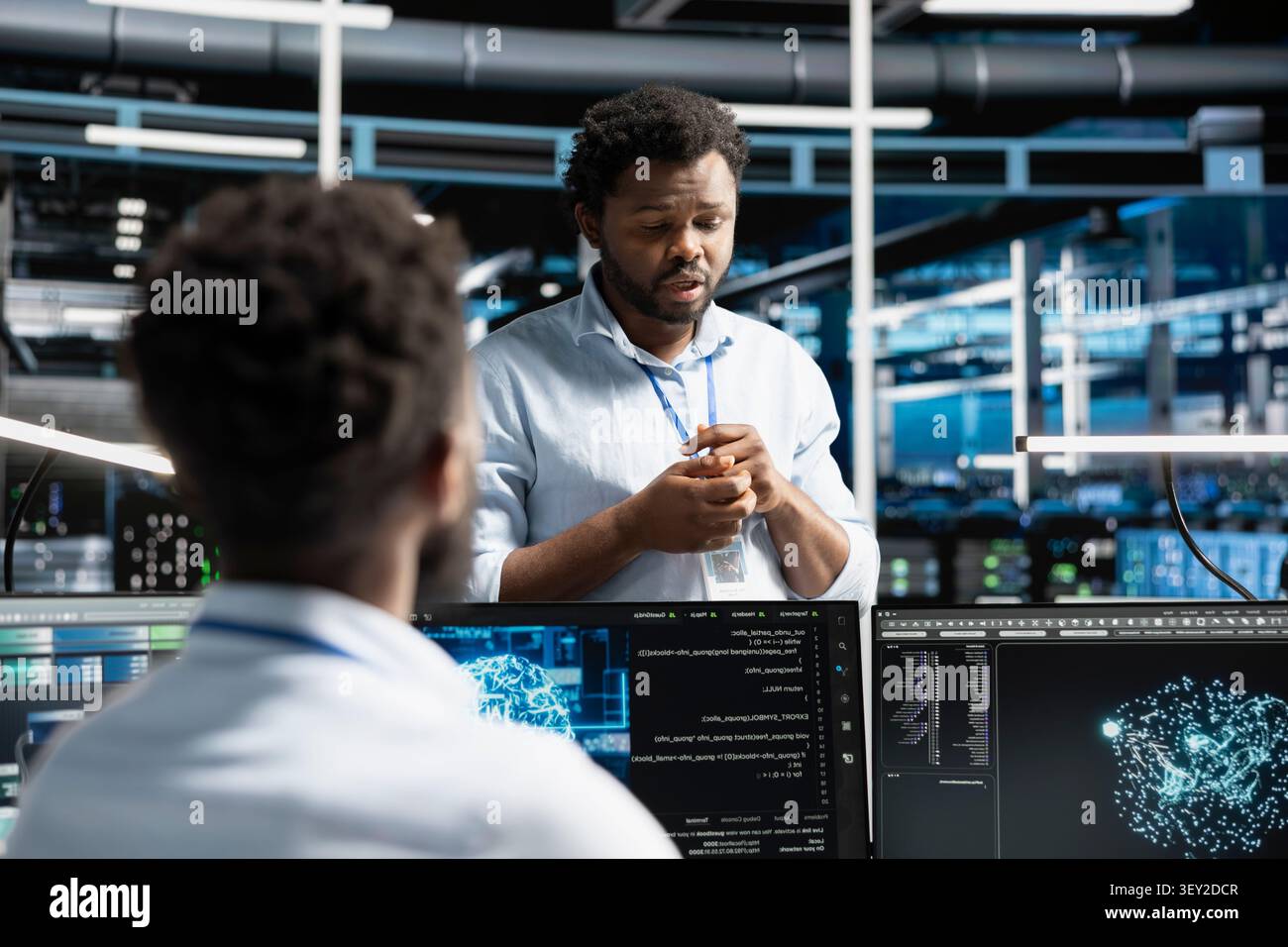 Software developers cooperate in a server farm, using machine learning algorithms to analyze datasets and recognize data patterns. Stock Photo