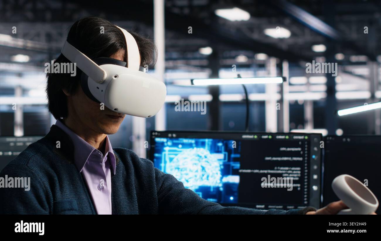 Programmer uses a VR headset to review AI diagnostics and manage server system performance. Stock Photo