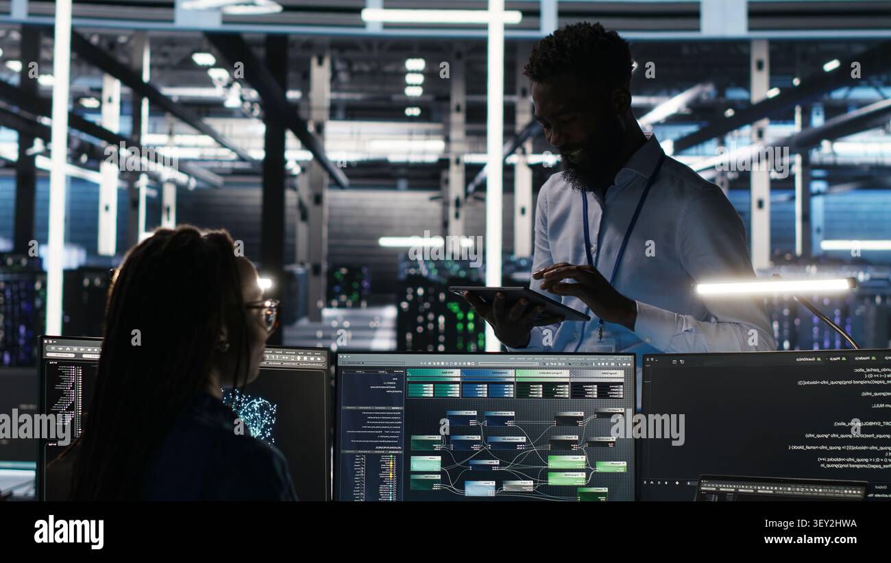 Data center manager uses node tree AI software to analyze infrastructure and identify issues in a data center. Stock Photo
