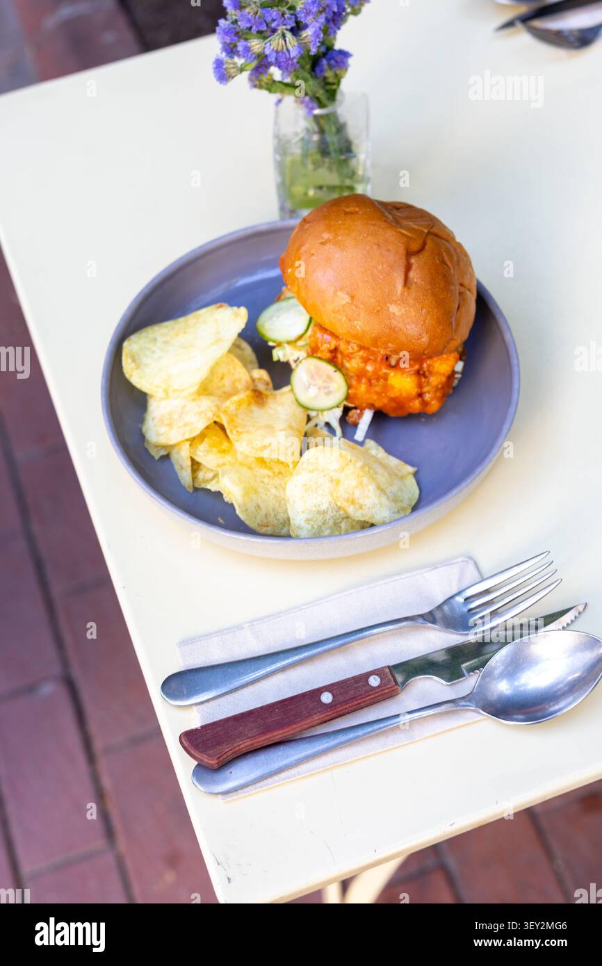 Cheeseburger and Chips Restaurant Presentation Close-Up Stock Photo