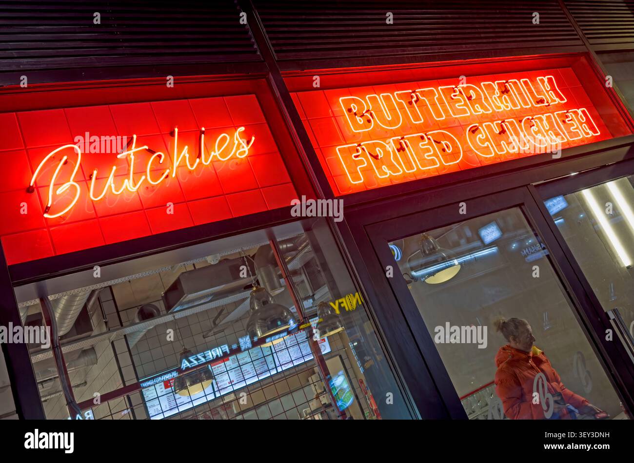 Neon Butchies sign promoting “The Best Fried Chicken in London” at the Bond Street restaurant near Ealing Broadway, west London Stock Photo