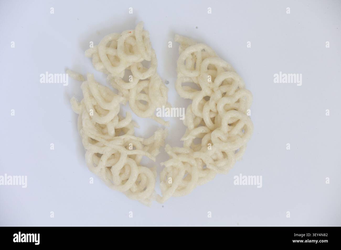 Broken Indonesian Cracker Isolated on White Background Stock Photo