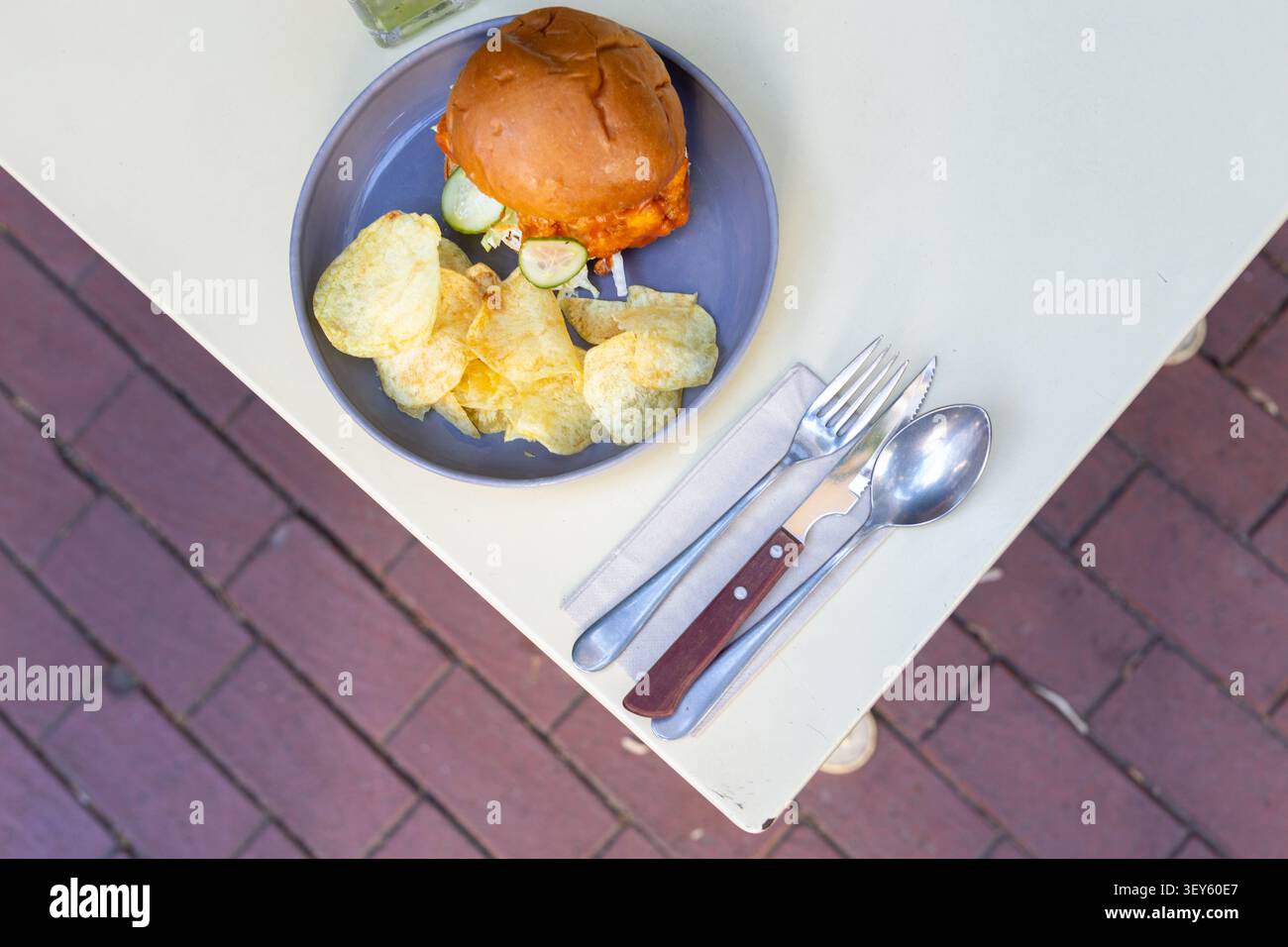 Cheeseburger and Chips Restaurant Presentation Close-Up Stock Photo