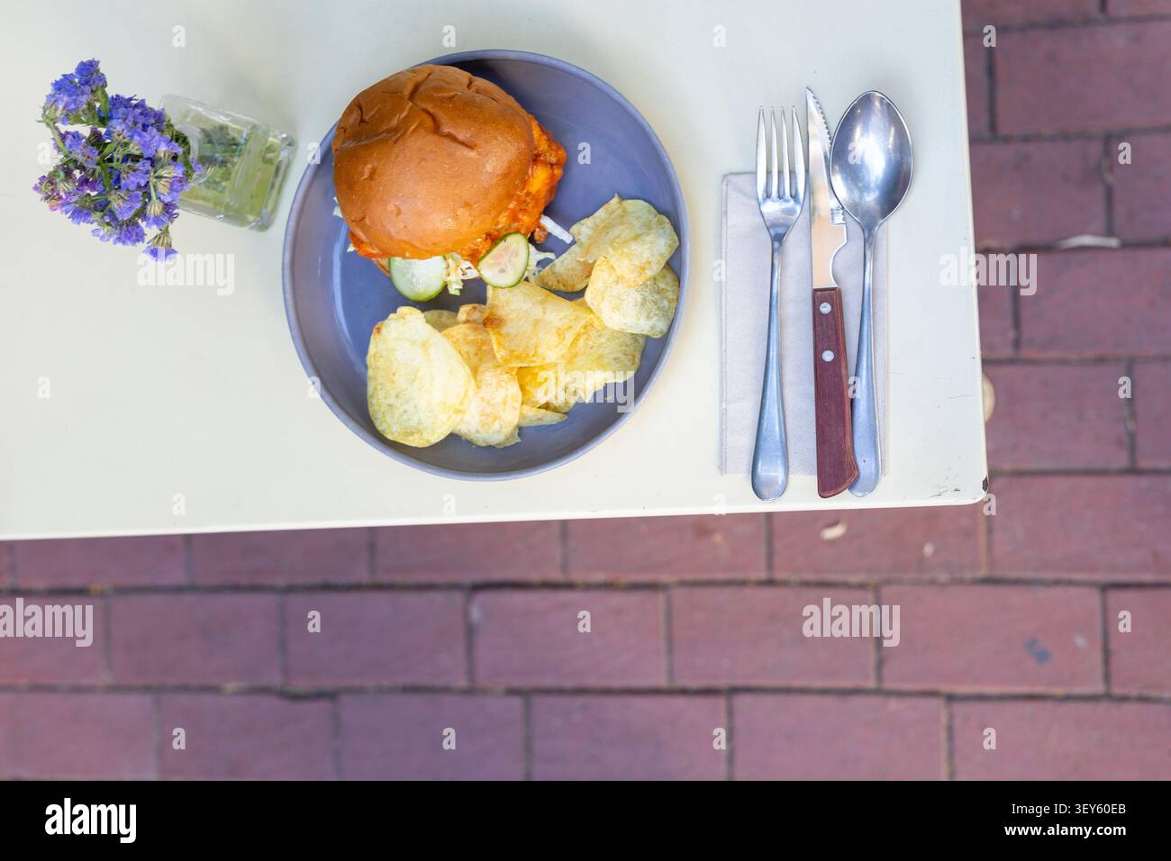 Cheeseburger and Chips Restaurant Presentation Close-Up Stock Photo