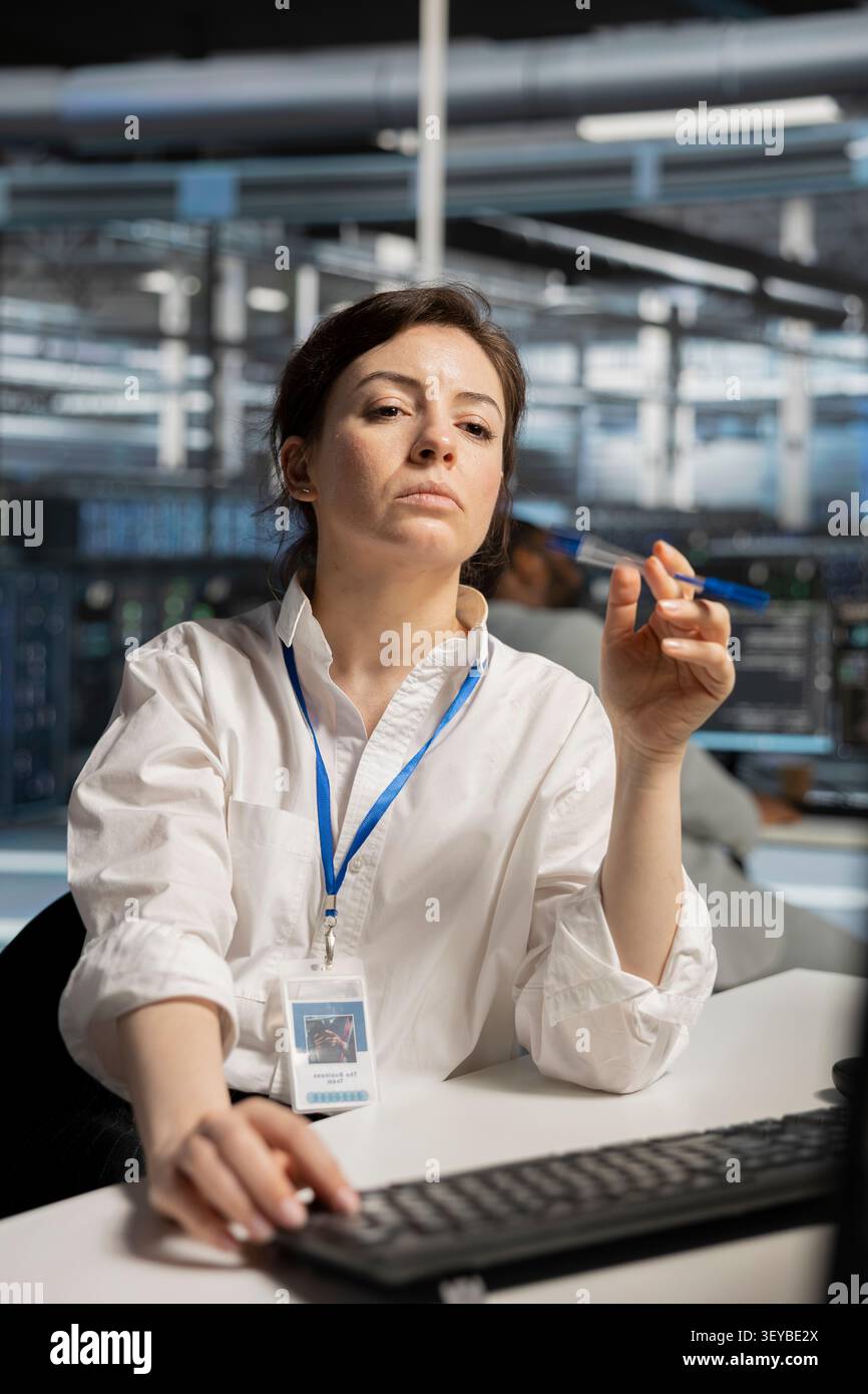 Data center technician deploys data backup solutions, managing server storage and supporting reliable recovery. Stock Photo