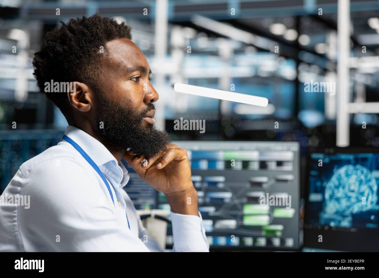 Server facility workplace technical specialist applying AI neural network models technology. Stock Photo