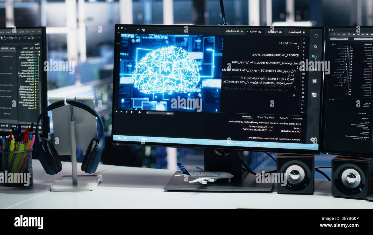 IT specialist reviews neural network visualization on computer screens in a server room during software debugging work. Stock Photo