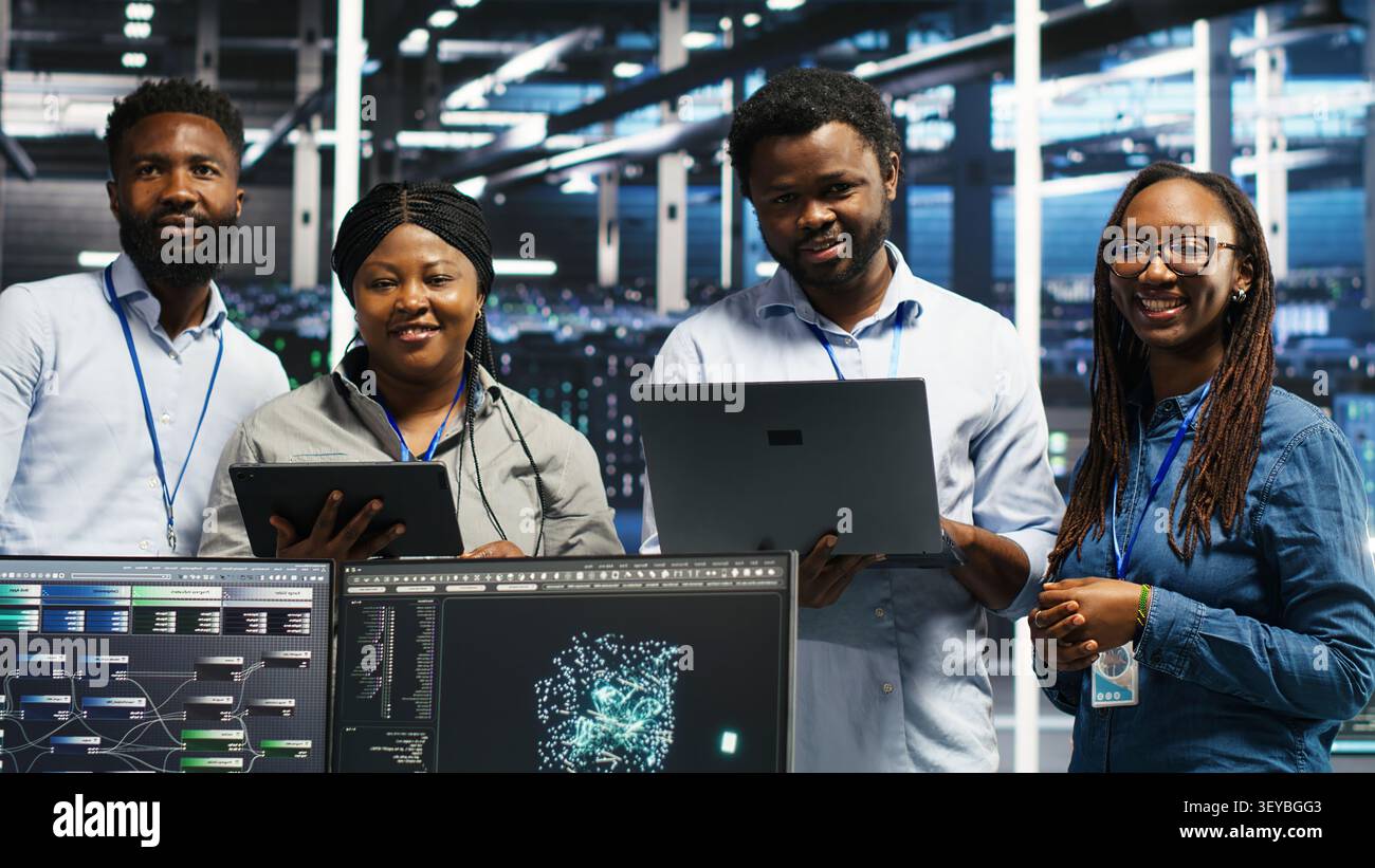Engineers use a computer workstation in a server hub to categorize unstructured data with node tree systems. Stock Photo