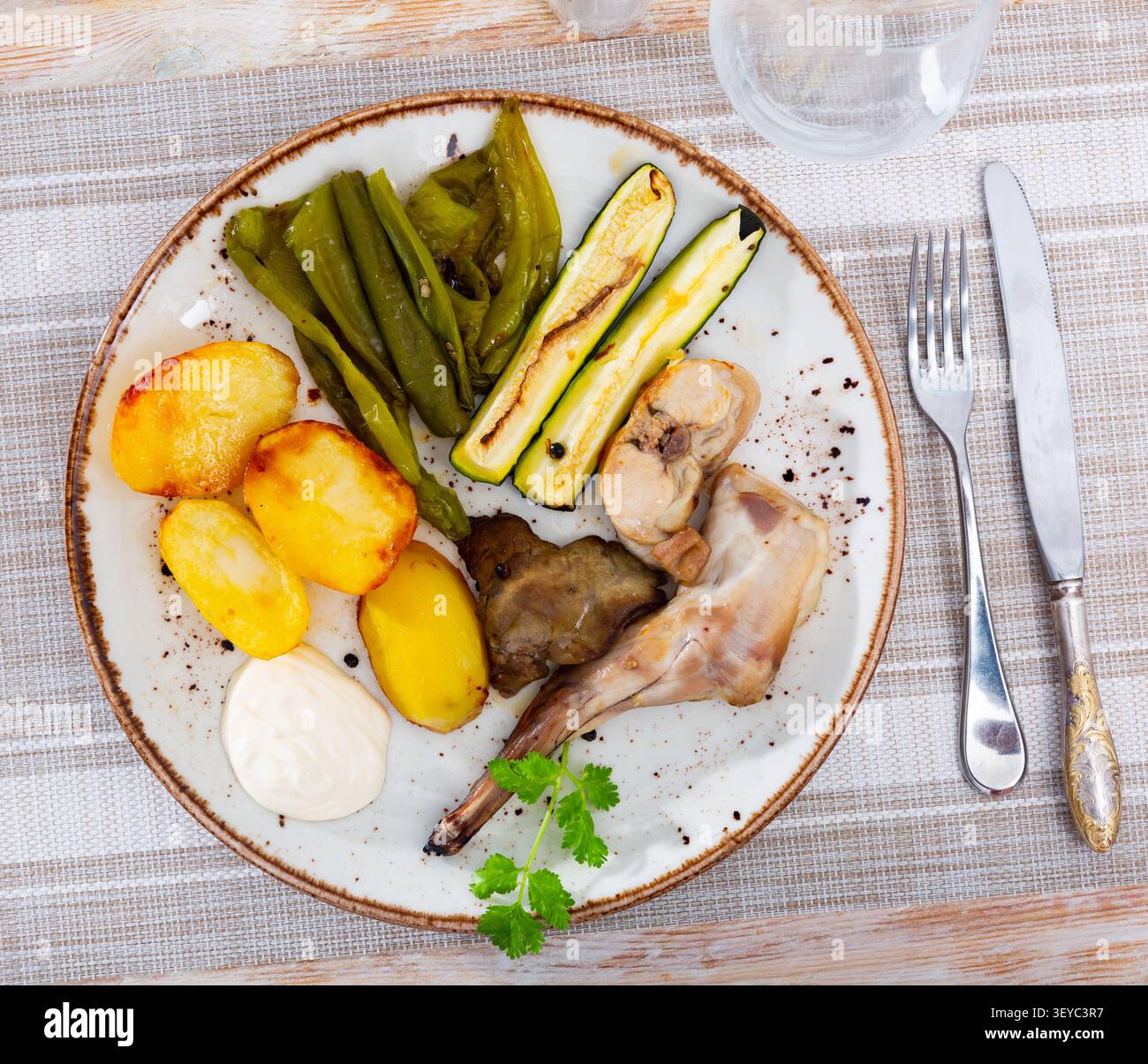Roasted rabbit served with vegetable garnish Stock Photo