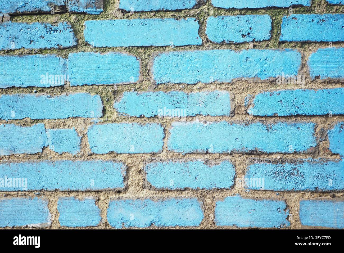 Bright blue brick wall with some texture and wear Stock Photo