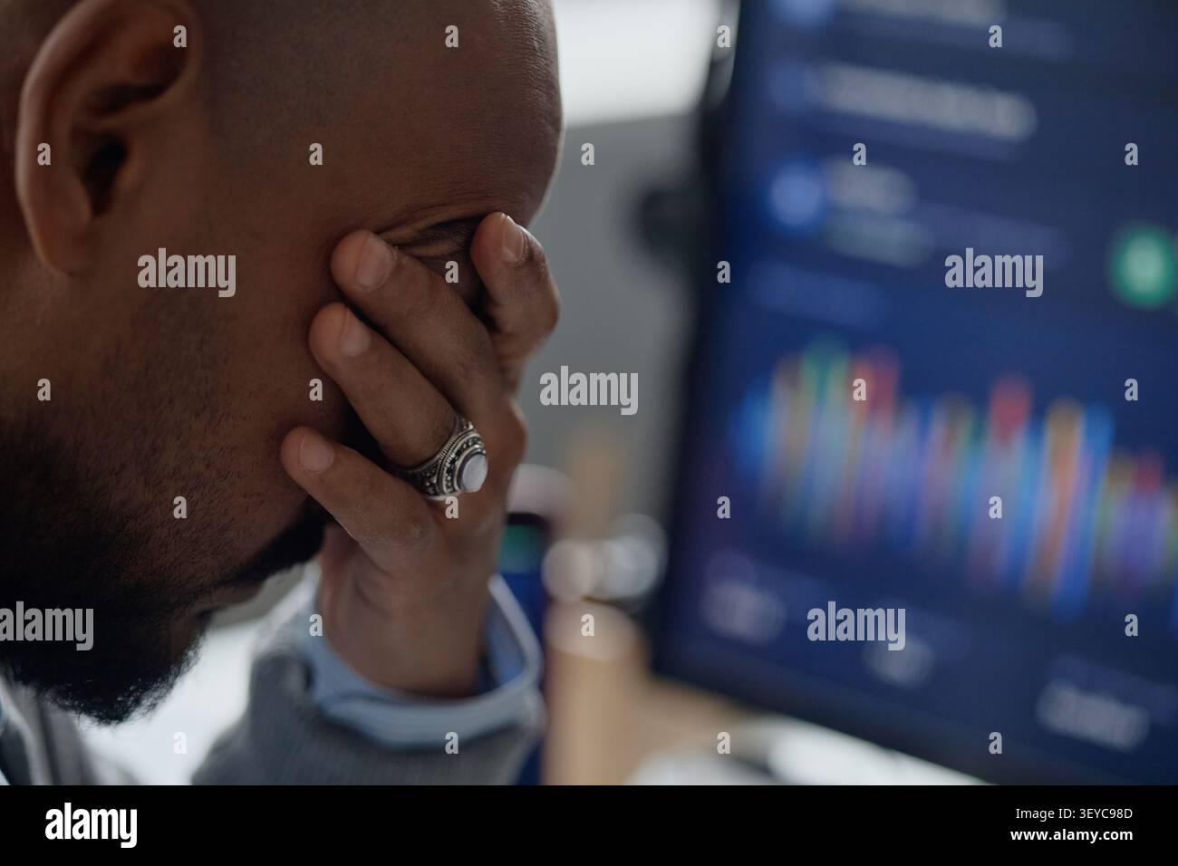 Man Analyzing Market Data on Computer in Information Office Stock Photo