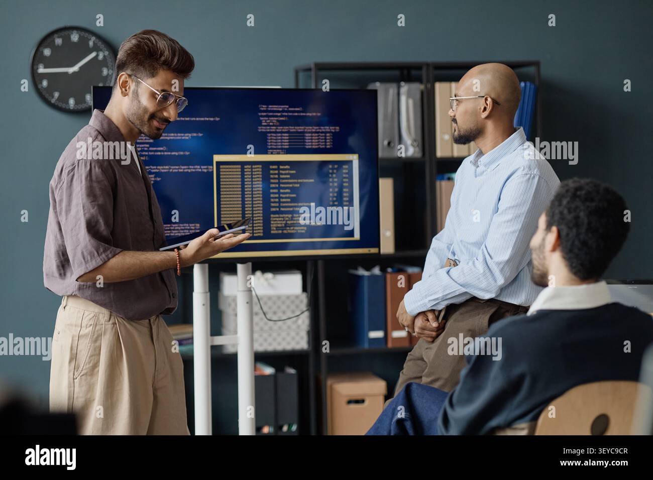 Diverse Men Discussing Software Development in Information Office Stock Photo