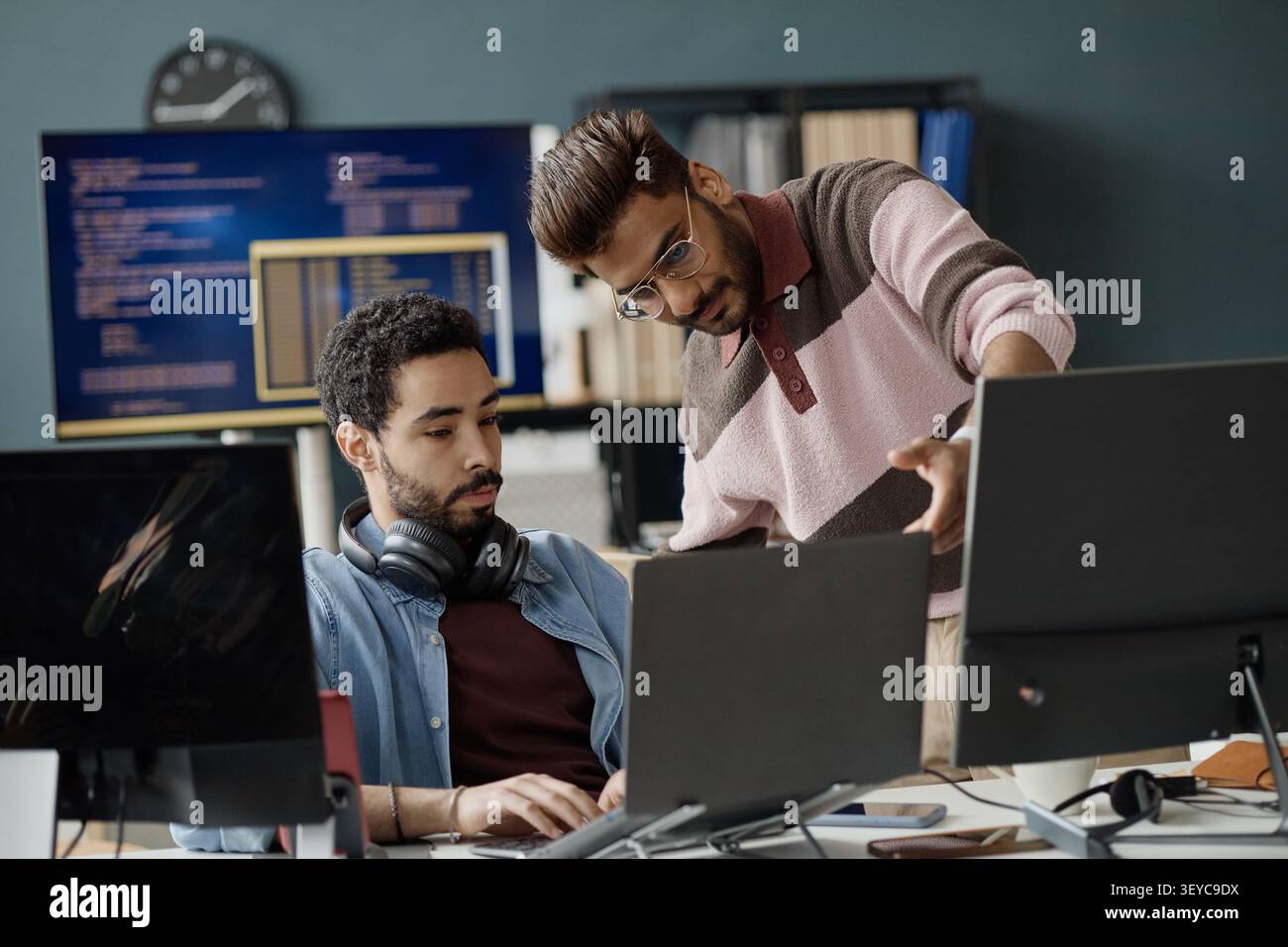Two Men Collaborating on Software Development in IT Office Stock Photo