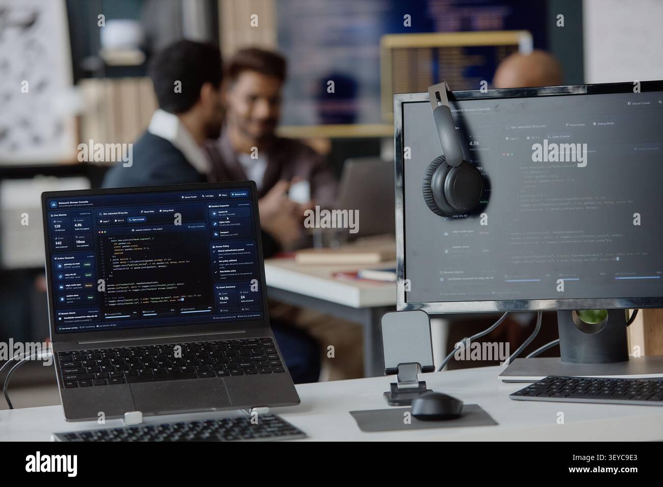 Software Developers Collaborating in Information Technology Office Stock Photo