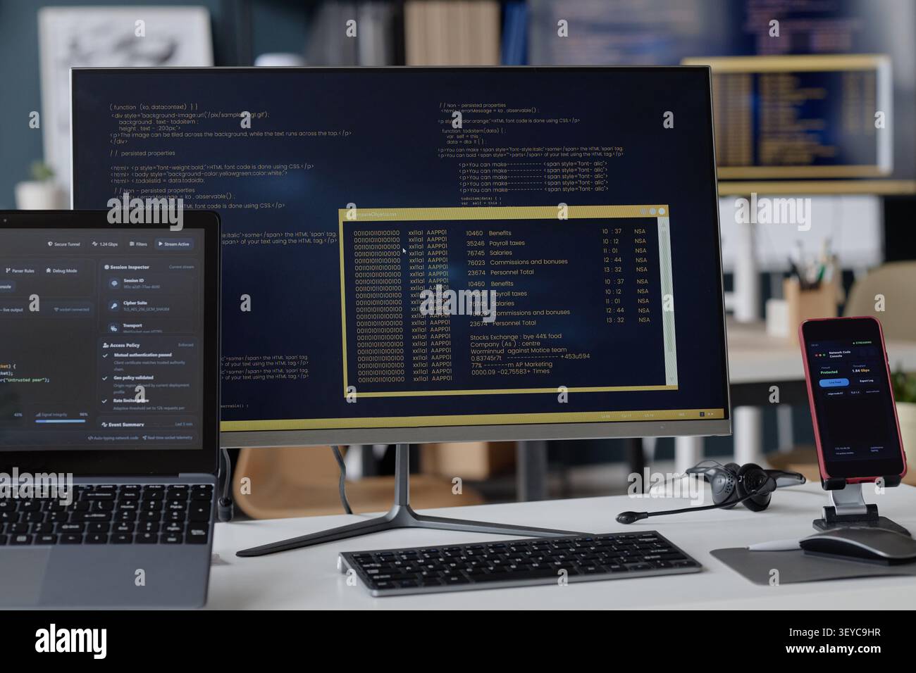 Information Technology Office Workstation Displaying Cybersecurity Data Stock Photo