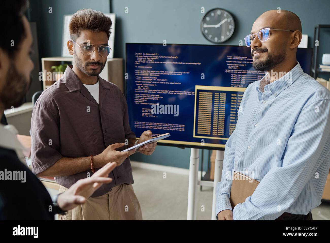 Indian Men Discussing Software Development in Information Office Stock Photo