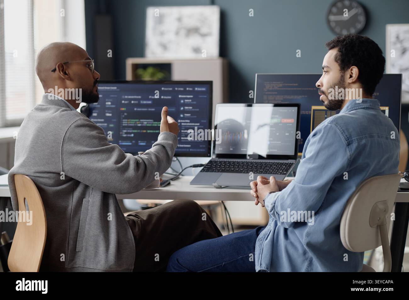 Men Discussing Software Development in Information Technology Office Stock Photo