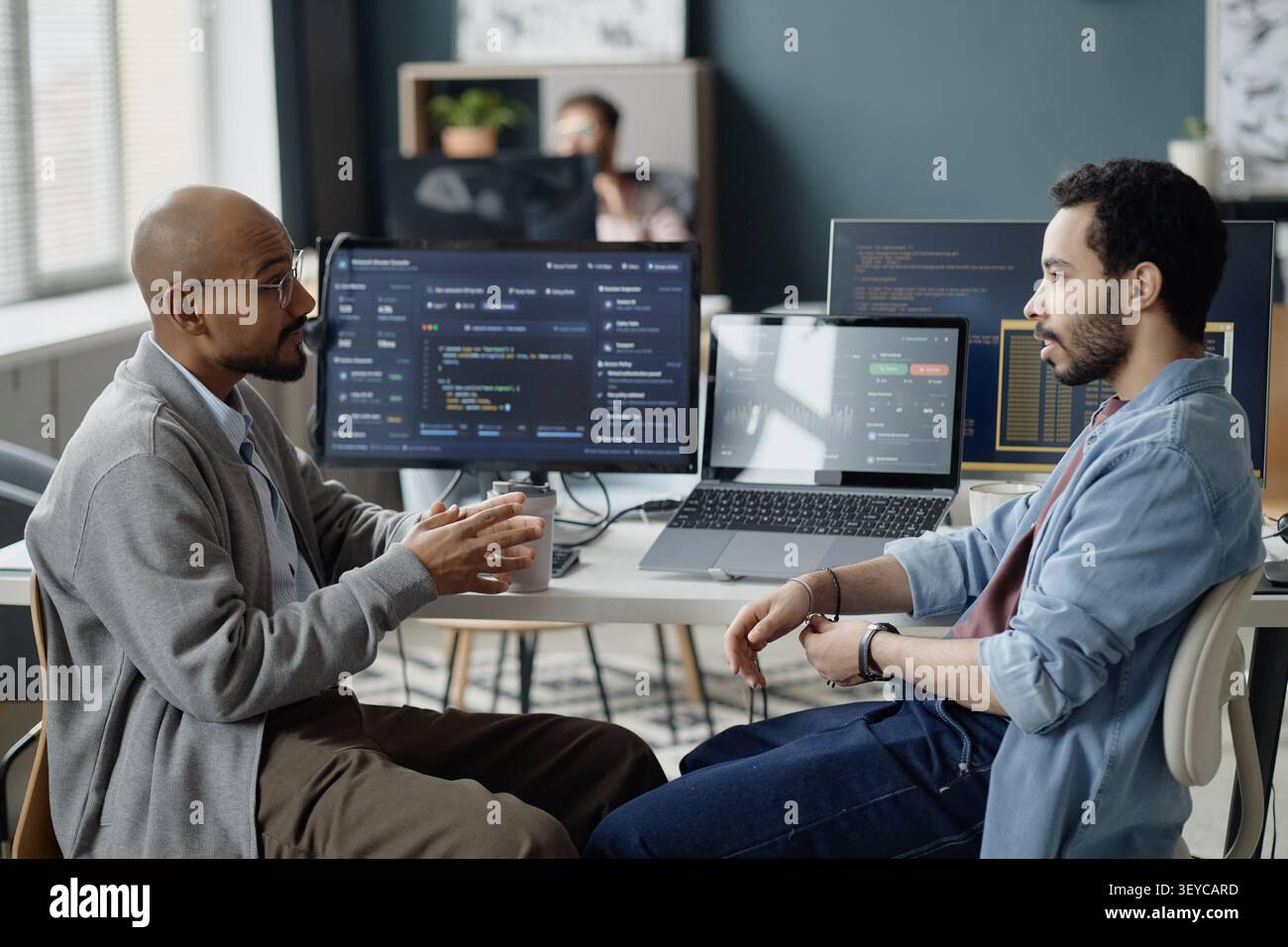 Men Discussing Software Development Strategy in it Office Stock Photo