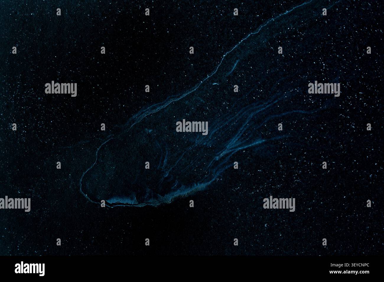 Abstract cosmic fluid art texture with dark blue nebula waves and starry glitter on black background Stock Photo